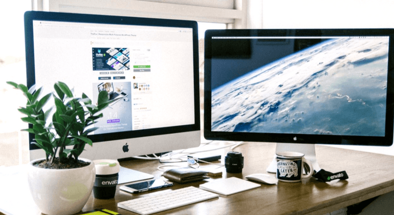 Tidy desk with dual computer monitors 