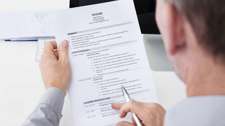 Man looking at resume 