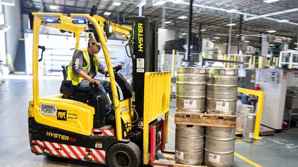 Forklift operator in warehouse